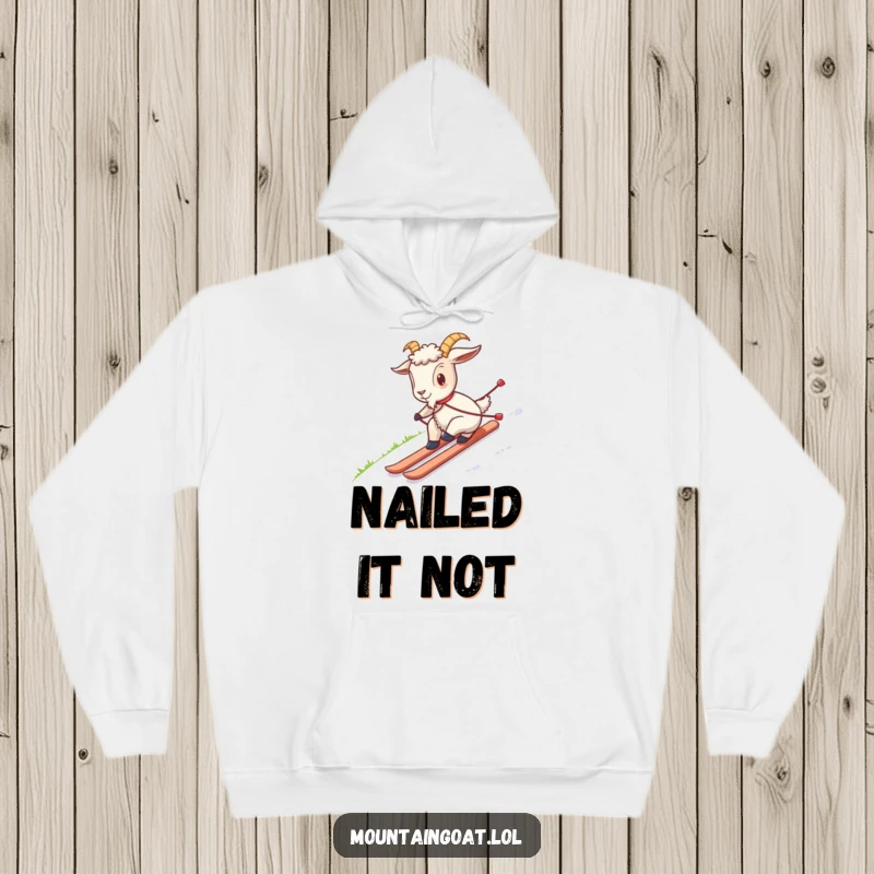 Funny hoodie with a goat awkwardly skiing down grass, ideal for warmth and a good laugh, a unique piece of apparel.