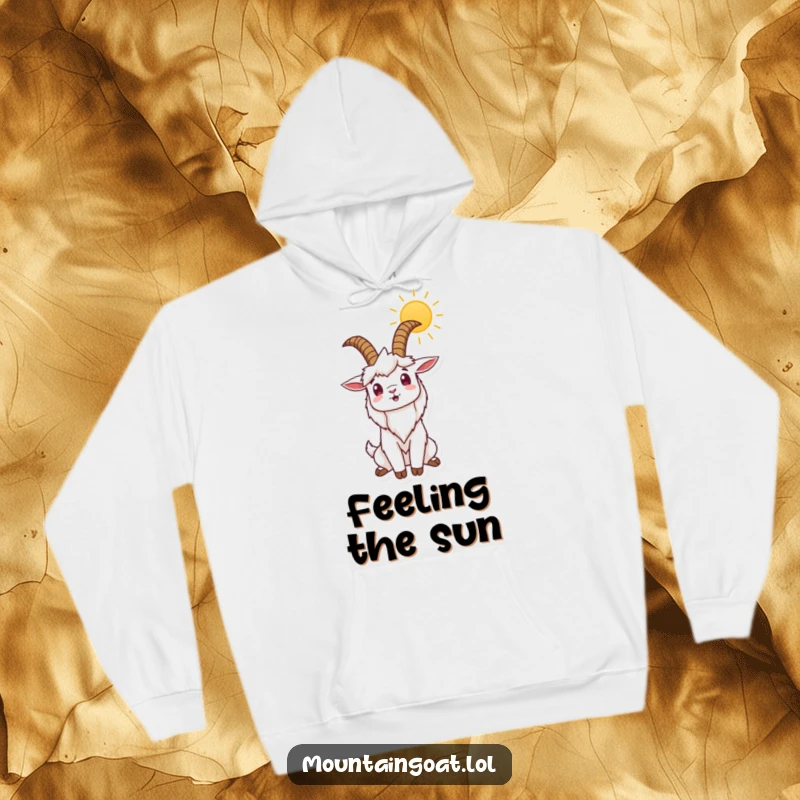Funny hoodie depicting a mountain goat stretching its horns joyfully towards the rising sun, conveying warmth and a humorous, positive outlook.