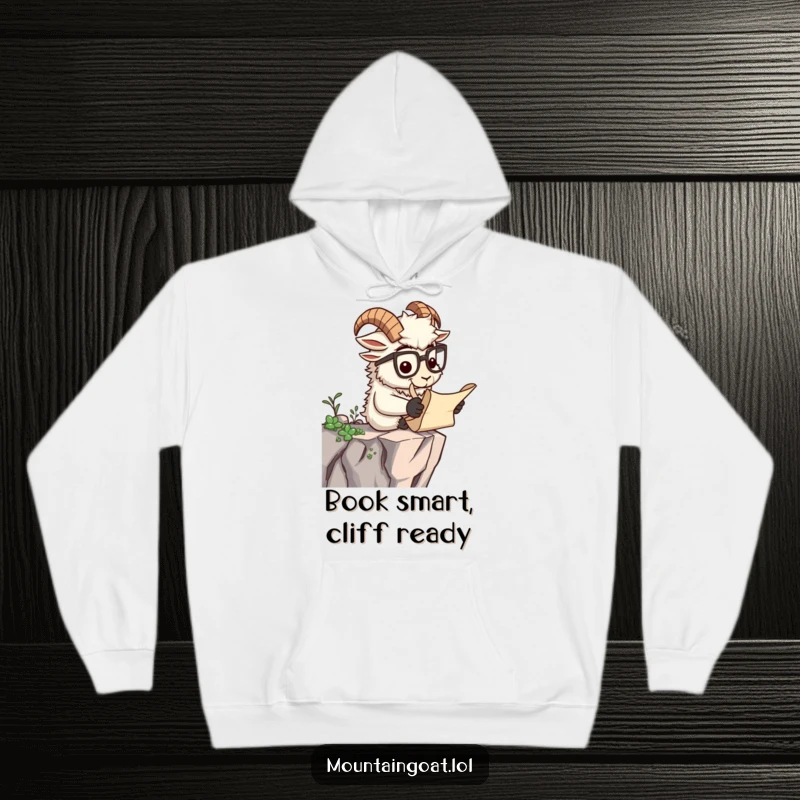 Funny hoodie featuring a wise mountain goat with spectacles reading a scroll on a cliff, combining comfort with intellect.