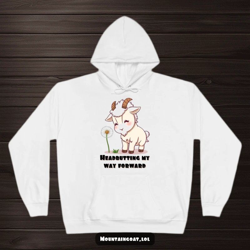 Funny Goat Dandelion Hoodie: A kawaii mountain goat gently headbutts a fluffy dandelion, radiating warmth and playful charm.