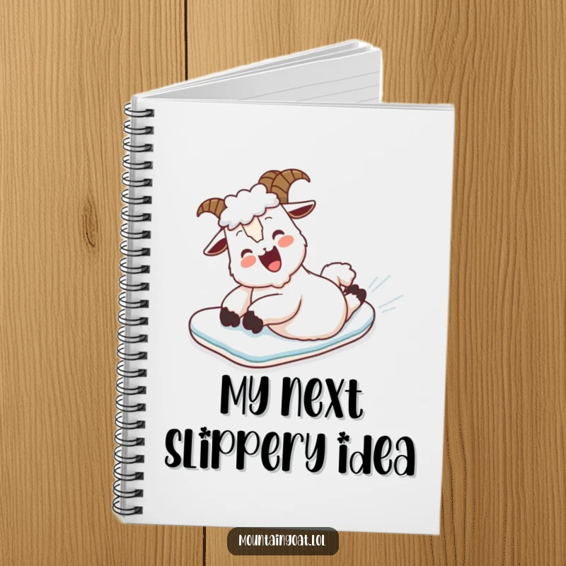 Funny Notebook: A mountain goat belly slides down a snowy mountain, adding humor to note-taking.