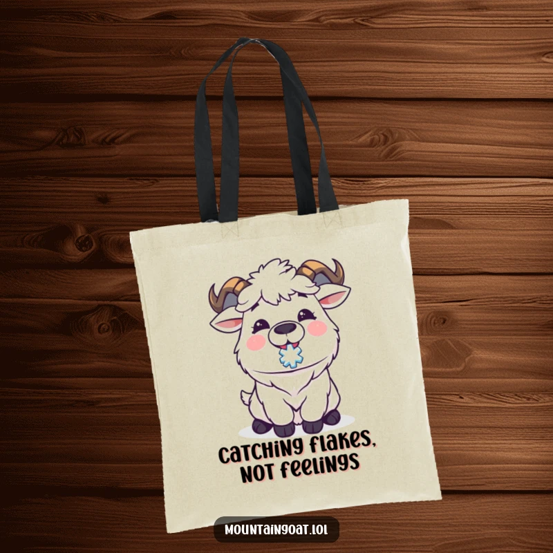 Funny Kawaii mountain goat happily catching a snowflake on its tongue, perfect for carrying essentials with joy. A whimsical tote bag.
